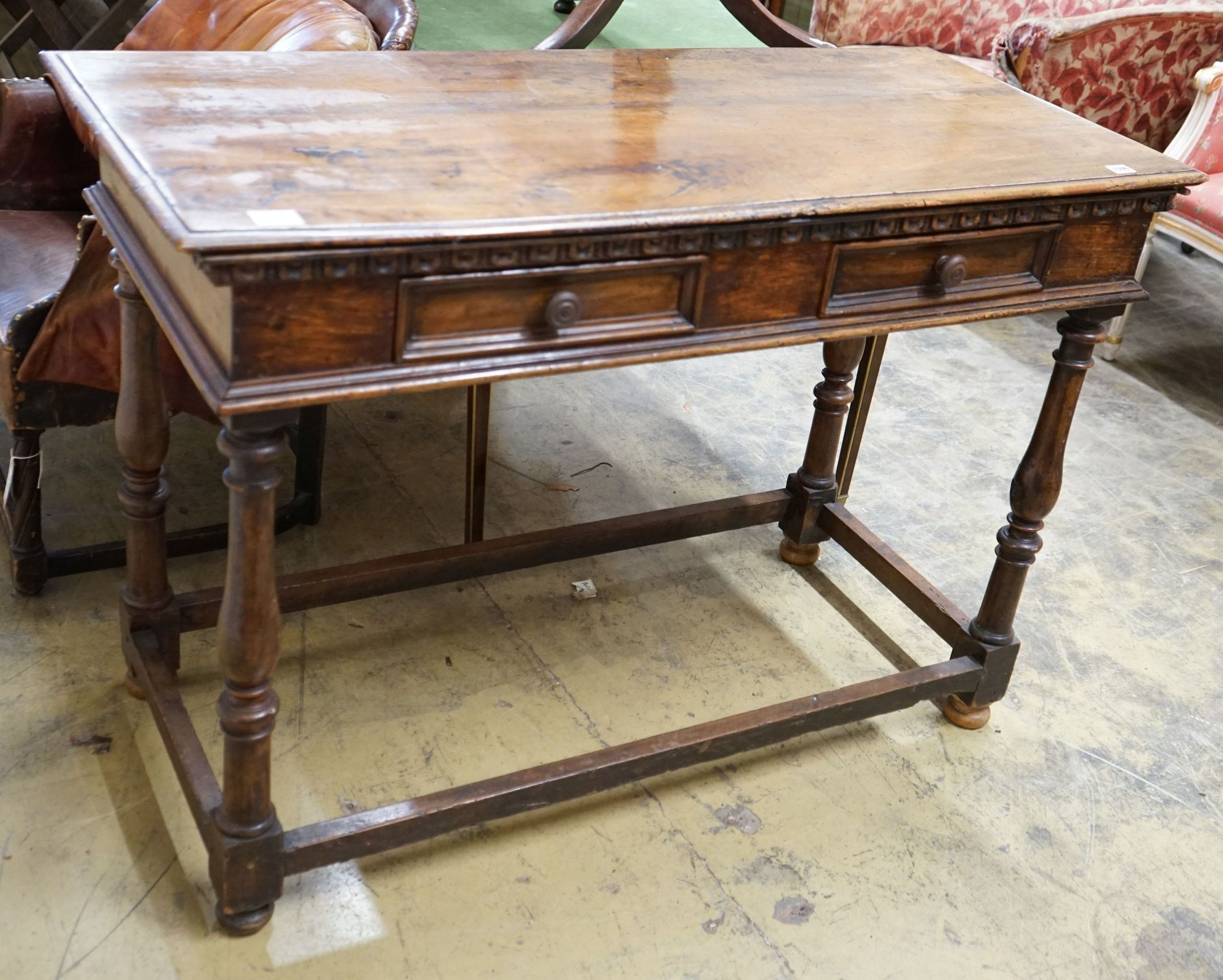 A Tuscan style walnut hall table with frieze drawers over turned legs united by stretchers, width 120cm, depth 55cm, height 85cm